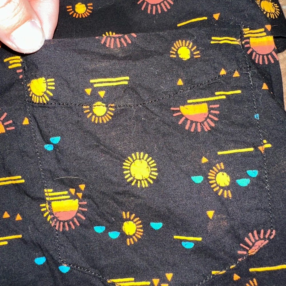 Women’s Kavu button down shirt sleeve top.